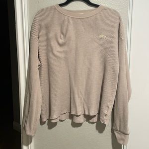 Beige waffle textured pull over.